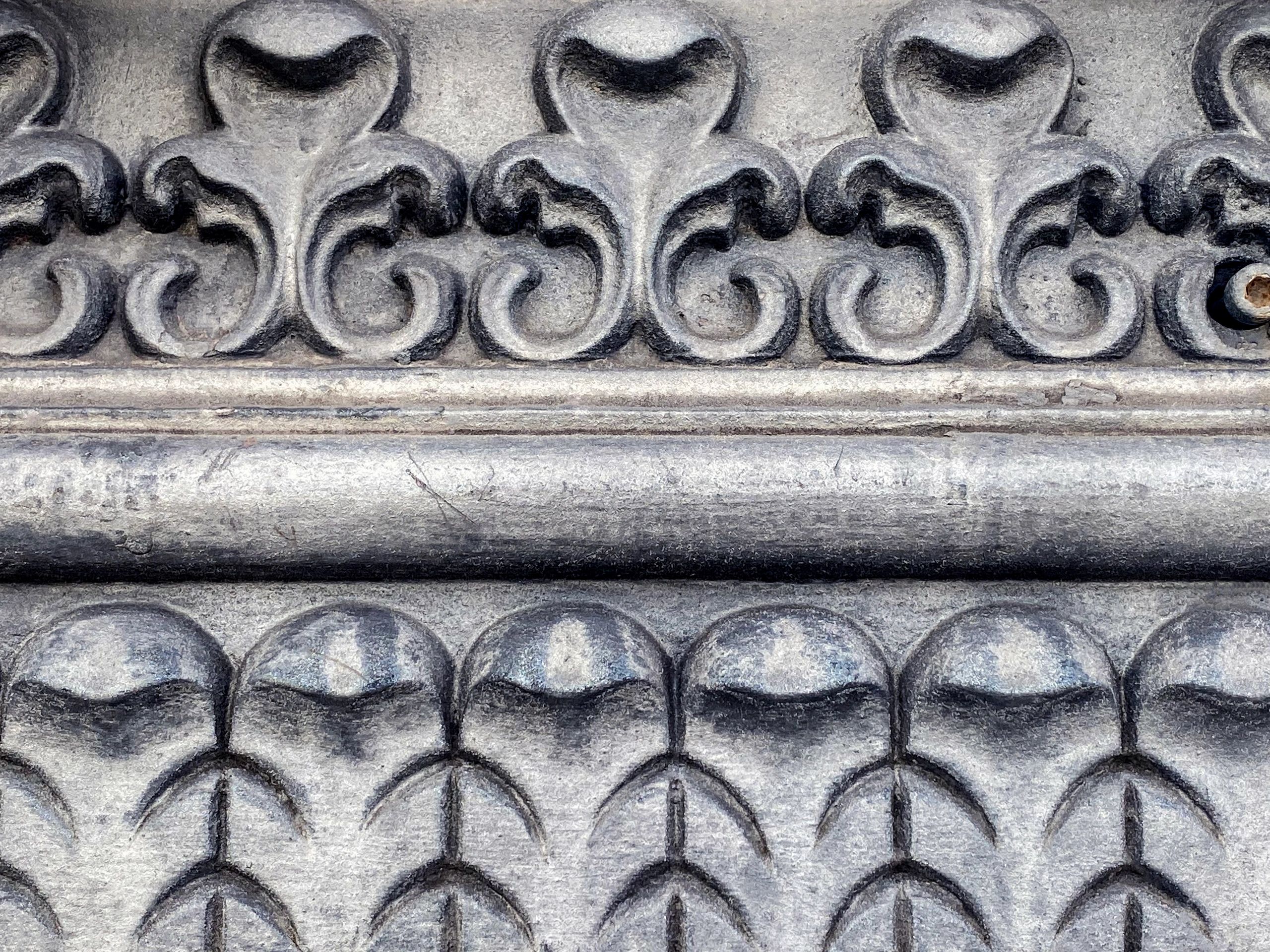 Detailed engraved metal ornament